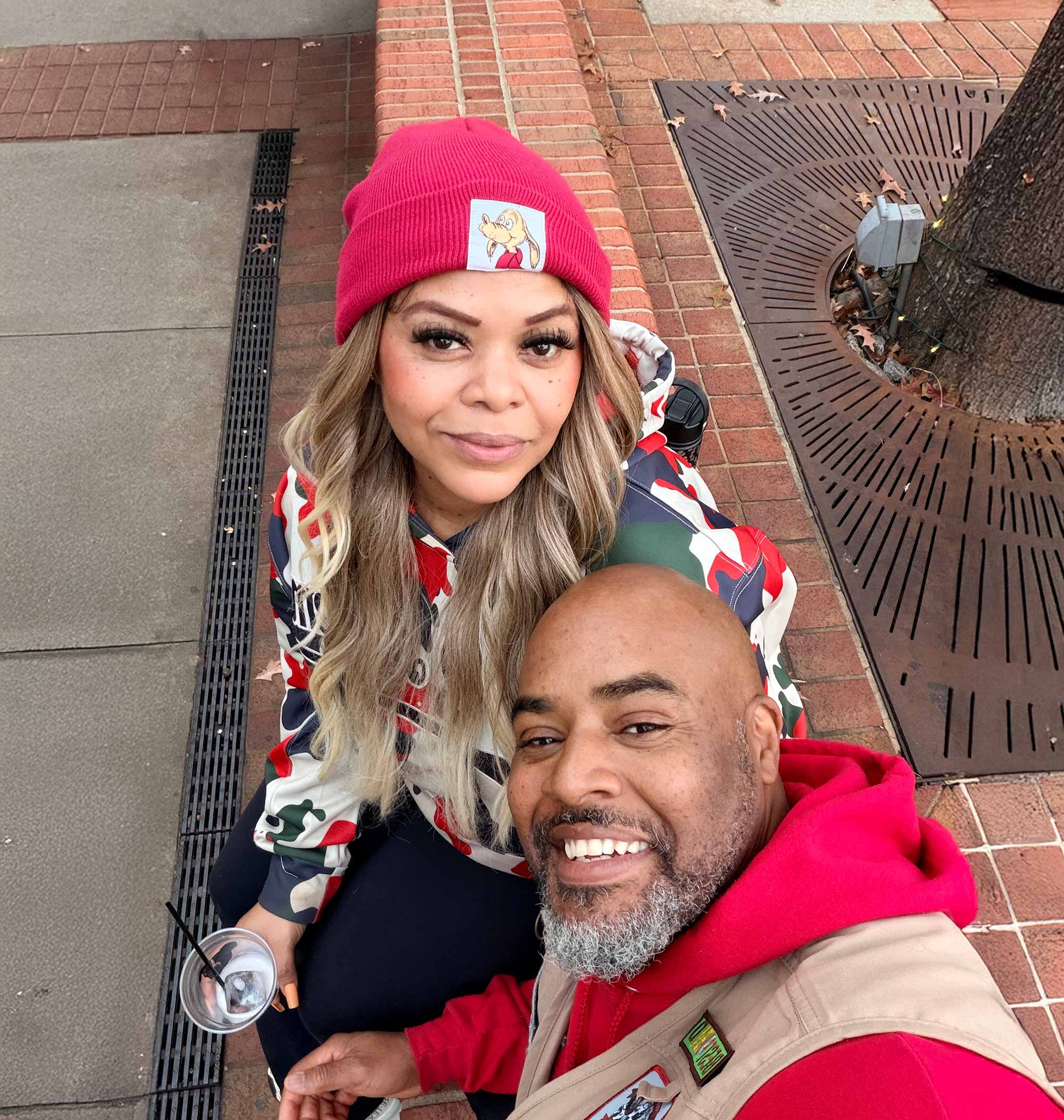 About 1 Darrell and Kim, founders of Off The Chain K9 Academy, smiling together outdoors, showcasing their commitment to dog training and education.